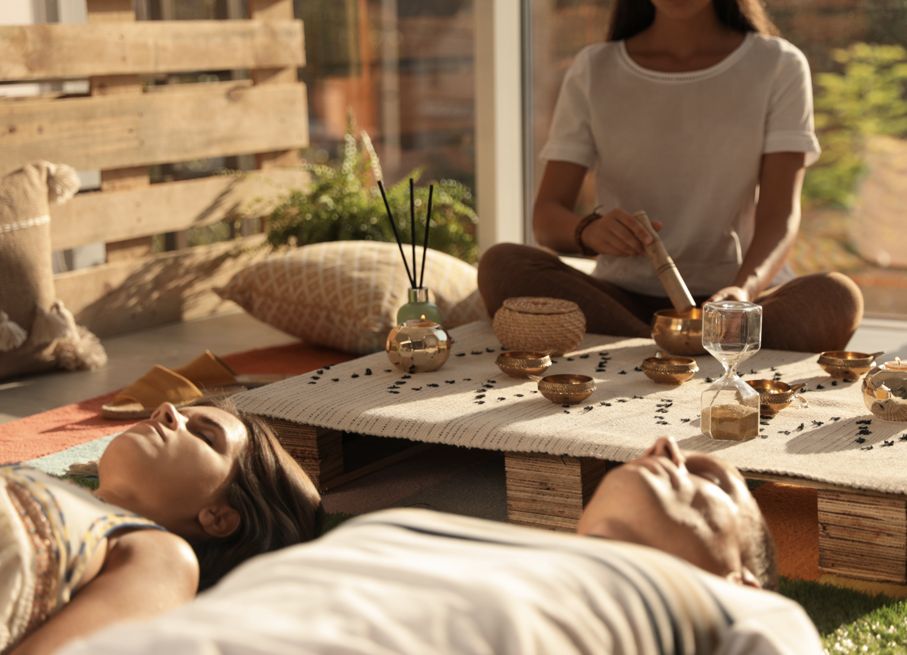 Sound Healer playing music for resting clients